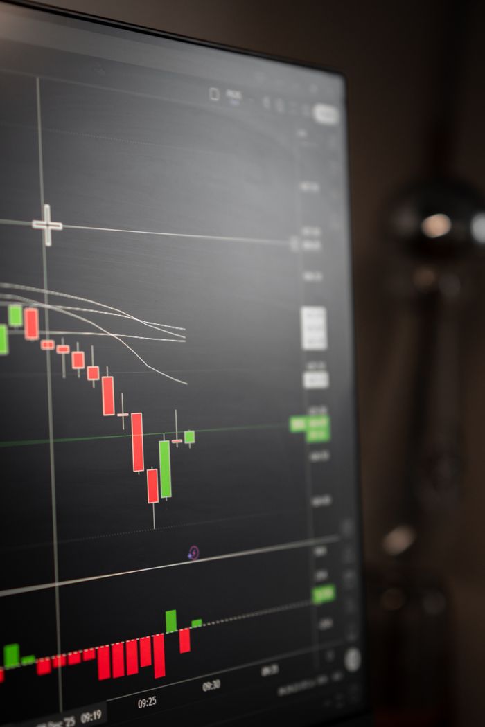 The Art of Drawing Readers In: Your attractive post title goes here Detailed view of a stock market graph on a computer screen, showcasing trends.